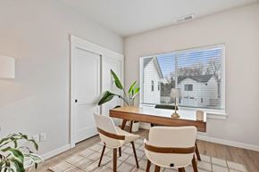 Garden City apartment for rent - A dining room with a table and chairs.