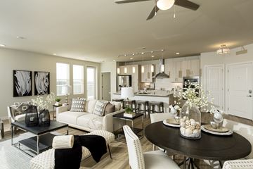 Richmond Heights apartment for rent - A modern living room with a black coffee table and white furniture.