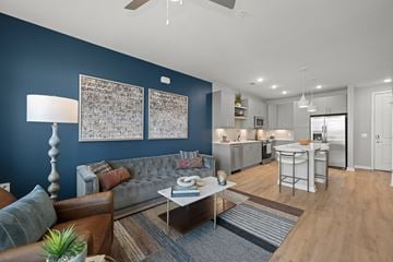 Charlotte apartment for rent - A living room with a grey couch and a coffee table.