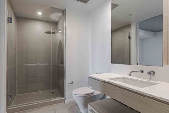 Sleek and modern bathroom finishes designed with contemporary fixtures and finishes
