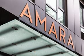 Portland apartment for rent - A sign with the word "AMARA" in orange letters is mounted on a building.