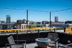 Portland apartment for rent - MERX rooftop patio with a hot tub and chairs overlooking the Pearl District and Mount Hood in the heart of Portland Oregon's beloved Slabtown neighborhood.