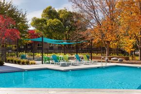 Salt Lake City apartment for rent - The Grove Apartments Pool Area and Lounge Chairs with Landscape