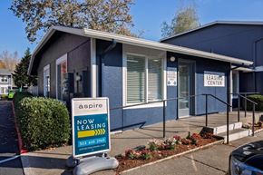 Gresham apartment for rent - A blue building with a sign that says "aspire leasing center".