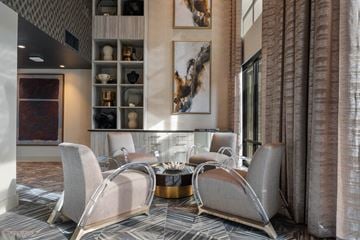 Tempe apartment for rent - A modern living room with a grey sofa and a coffee table.