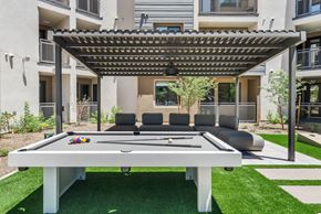 Tempe apartment for rent - is set up outside on a green lawn.