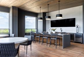 Lewisville apartment for rent - A modern kitchen with a dining table and chairs.