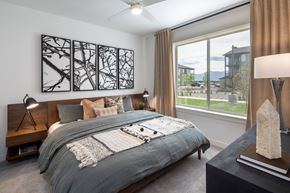 Colorado Springs apartment for rent - a bedroom with a bed and a large window