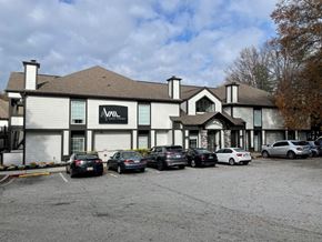 Sandy Springs apartment for rent - A parking lot in front of a building with the letters AVAL on it.