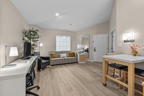 Sandy Springs apartment for rent - A well-lit room with a desk, couch, and a dining table.