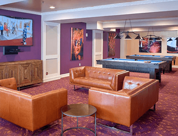 Luxury lounge with pool tables and seating