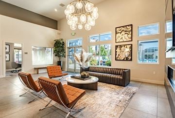 Sandy apartment for rent - a living room with couches and chairs and a chandelier