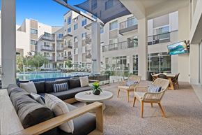 Phoenix apartment for rent - A modern outdoor living space with a pool and lounge chairs.