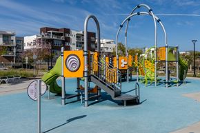 Chula Vista townhouse for rent - A playground with a slide, swings, and a climbing frame.