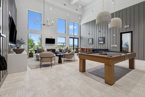 Austin apartment for rent - A spacious room with a pool table and a television.