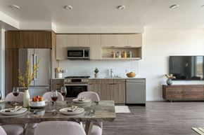 Kirkland apartment for rent - A modern kitchen with a dining table set for two.