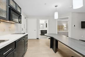 Houston apartment for rent - A modern kitchen with a long island in the middle.