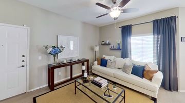 Orem apartment for rent - a living room with a white couch and a coffee table