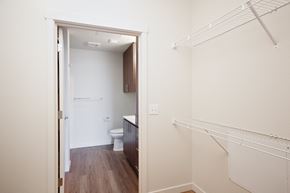 Portland apartment for rent - a bedroom with a closet and a bathroom with a toilet