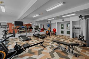 Portland apartment for rent - On-site fitness center with machines, weights, and tv at Collins Circle apartments in the Goose Hollow district in Portland, Oregon.