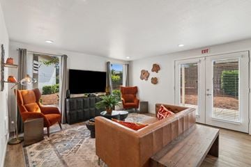 Gresham apartment for rent - A living room with a brown couch and a television.