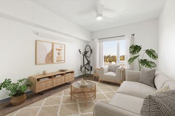 Seattle apartment for rent - A living room with a white couch, a wooden coffee table, and a painting on the wall.