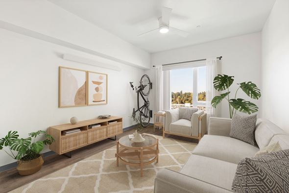 Seattle apartment for rent - A living room with a white couch, a wooden coffee table, and a painting on the wall.