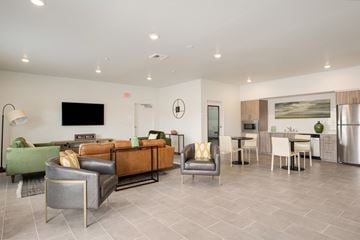 Walla Walla apartment for rent - a living room with couches and chairs and a kitchen with a table and a