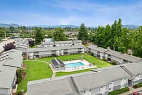 Springfield apartment for rent - Apartment complex with a pool and green lawns.
