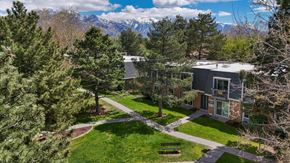 Murray apartment for rent - A building with a green lawn in front of it.