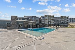 Aberdeen apartment for rent - a swimming pool with an apartment building in the background