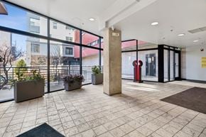 Denver apartment for rent - A large open space with a tiled floor and a pillar in the middle.
