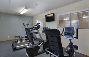 Ogden apartment for rent - A gym room with treadmills and exercise bikes.