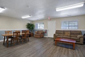 Ogden apartment for rent - A living room with a dining table and chairs.