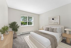 Portland apartment for rent - A bedroom with a large bed and a window.