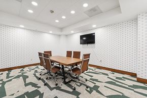 Dallas apartment for rent - A conference room with a large table and chairs.
