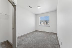 Salem apartment for rent - A room with a carpeted floor and a window showing a building outside.