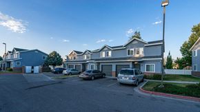 West Jordan apartment for rent - Avion Townhomes Exterior Townhomes with Garages and Cars Parked in Front