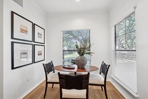 Richardson apartment for rent - A dining room with a table and chairs and pictures on the wall.