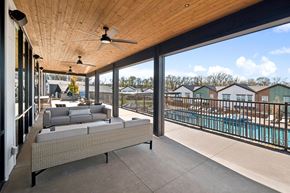 Melissa apartment for rent - A patio with a couch and a pool in the background.