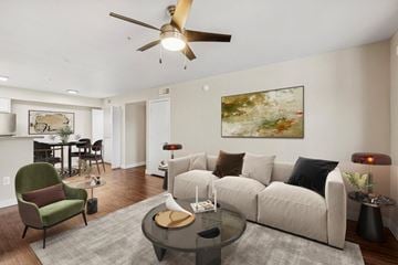 Flagstaff apartment for rent - A living room with a green chair and a white couch.