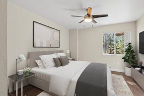 Flagstaff apartment for rent - A bedroom with a large bed and a ceiling fan.
