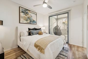 Chandler apartment for rent - A bedroom with a large bed and a painting on the wall.