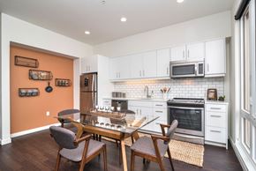 Portland apartment for rent - A kitchen with a table and chairs in front of it.