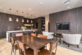 Portland apartment for rent - A modern dining room with a wooden table and chairs.