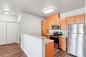 Lebanon apartment for rent - A kitchen with wooden cabinets and stainless steel appliances.