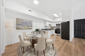 Gillette apartment for rent - A modern dining room with a round table set for six.