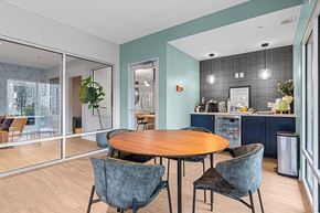Layton apartment for rent - a dining area with a table and chairs and a kitchen in the background