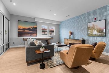 Layton apartment for rent - a living room with a blue accent wall and a couch