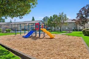 Corvallis apartment for rent - A playground with a blue and yellow slide.